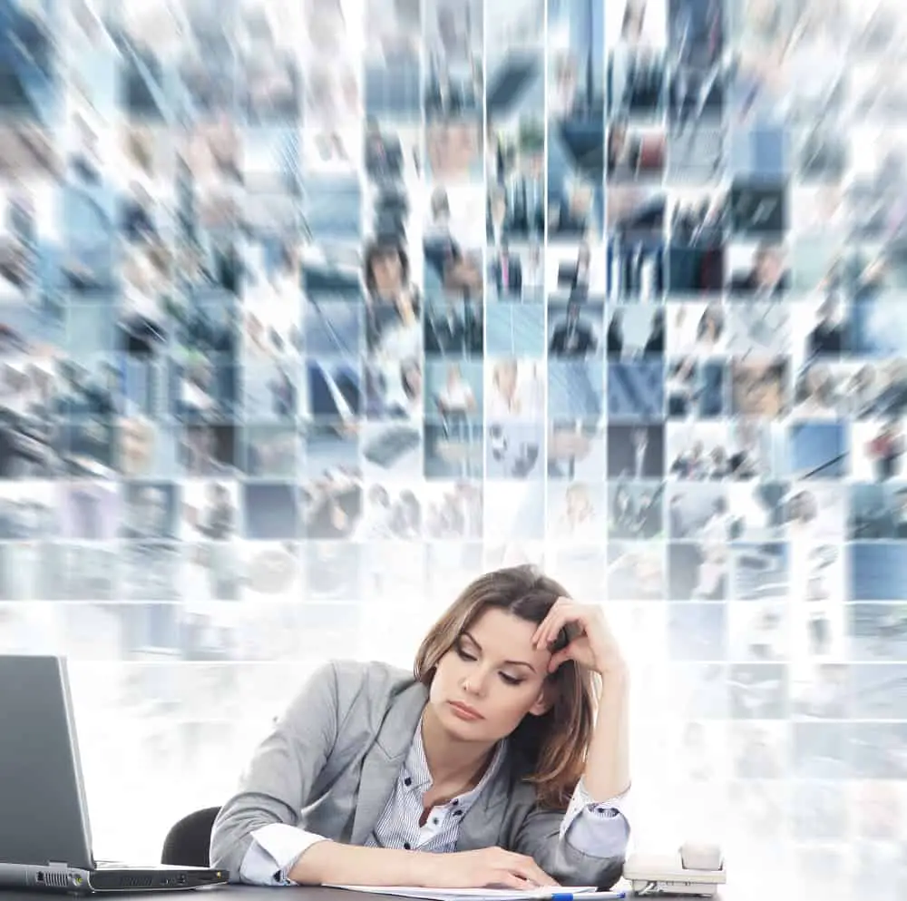 Stresses woman sitting in front of her laptop computer