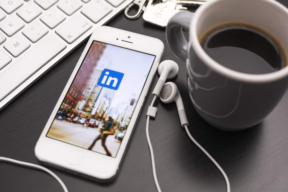 LinkedIn app icon shown on mobile phone