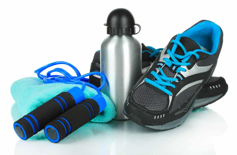 health and fitness equipement - trainers, skipping rope and water bottle.