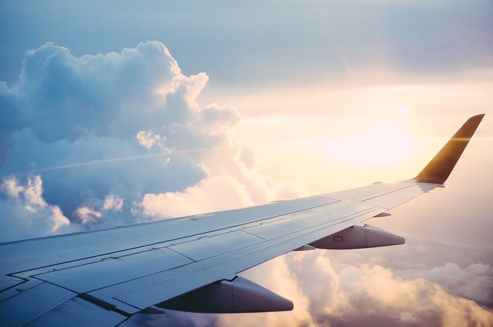 Airplane wing above the clouds