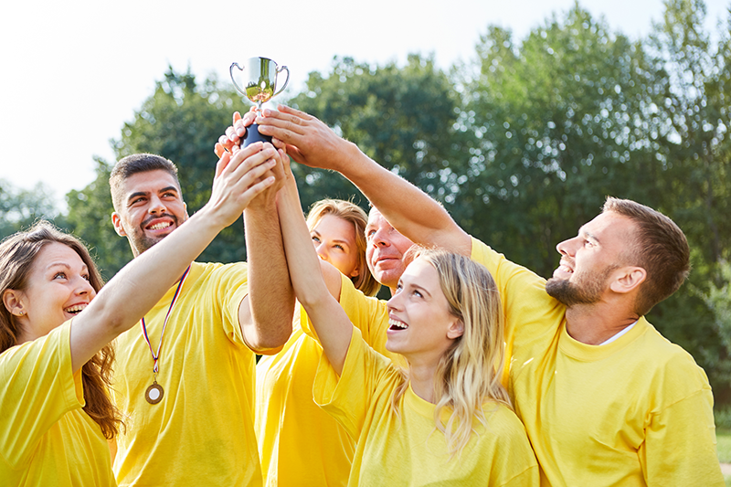 Employees wearing yellow shirts on a team bulding events