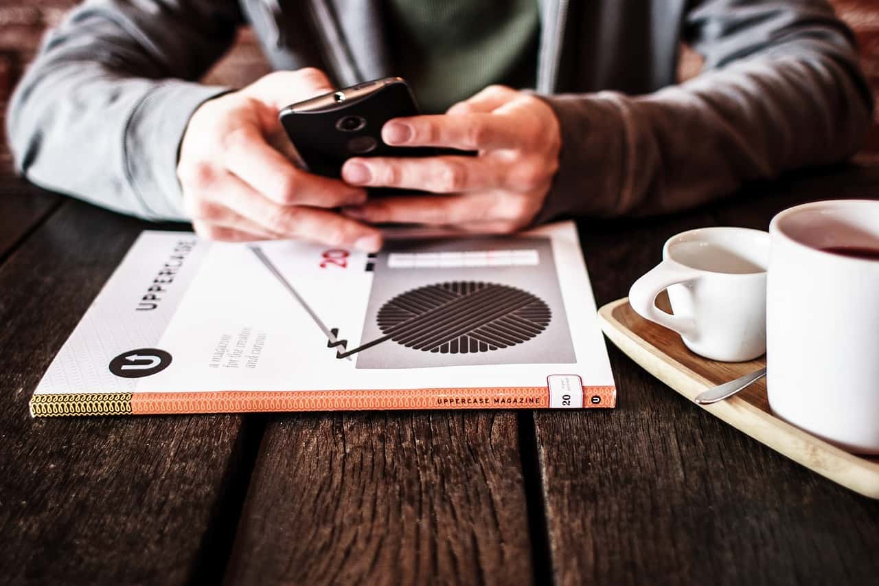 person holding smartphone in their hands