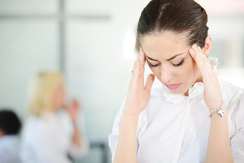 Woman experiencing headache