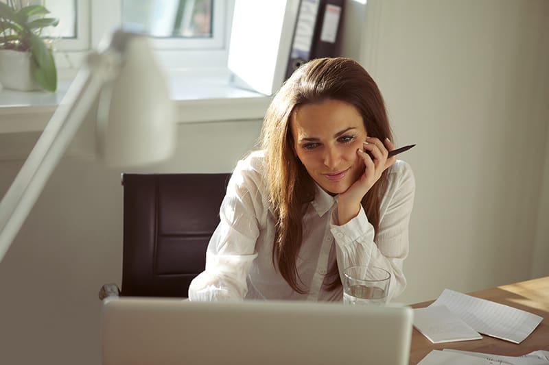 woman blogging on laptop