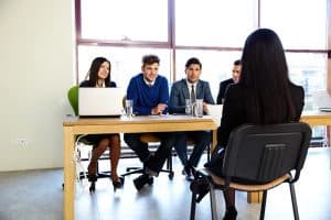 Woman sitting at job interview in office