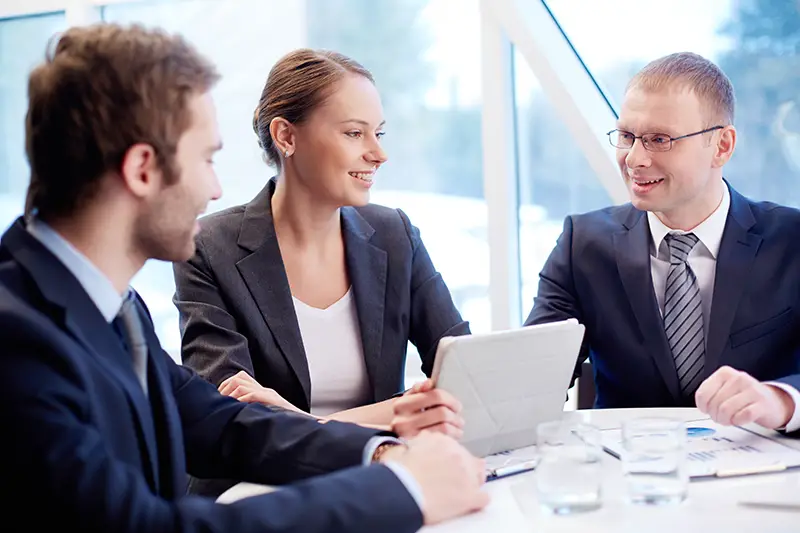Group of confident business partners planning work at meeting