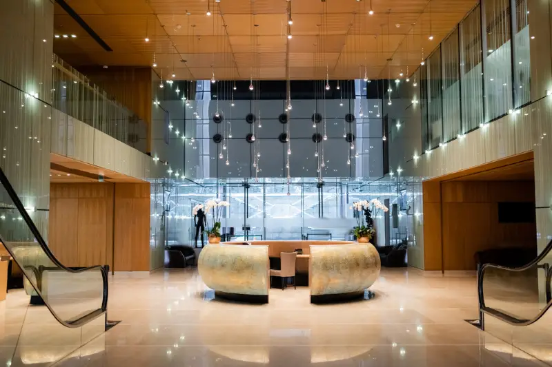 Reception in spacious lobby of modern luxury hotel