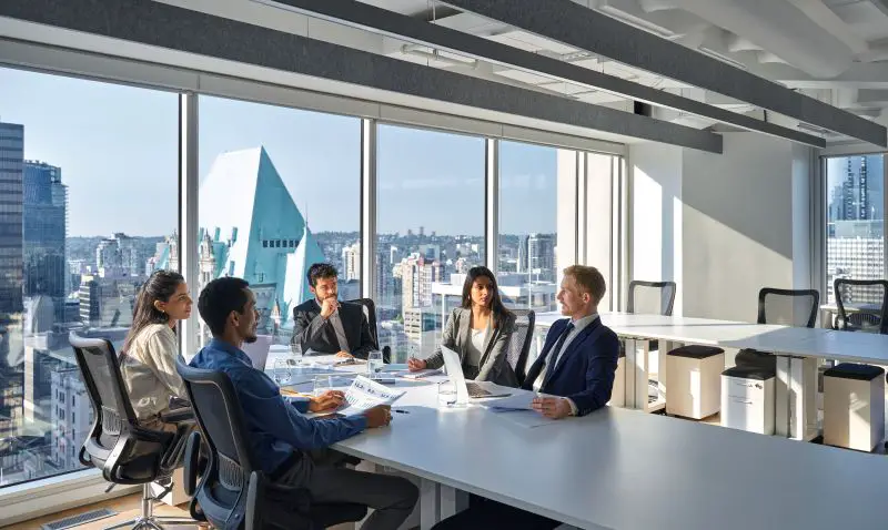 Busy diverse board executives team people working in meeting room.