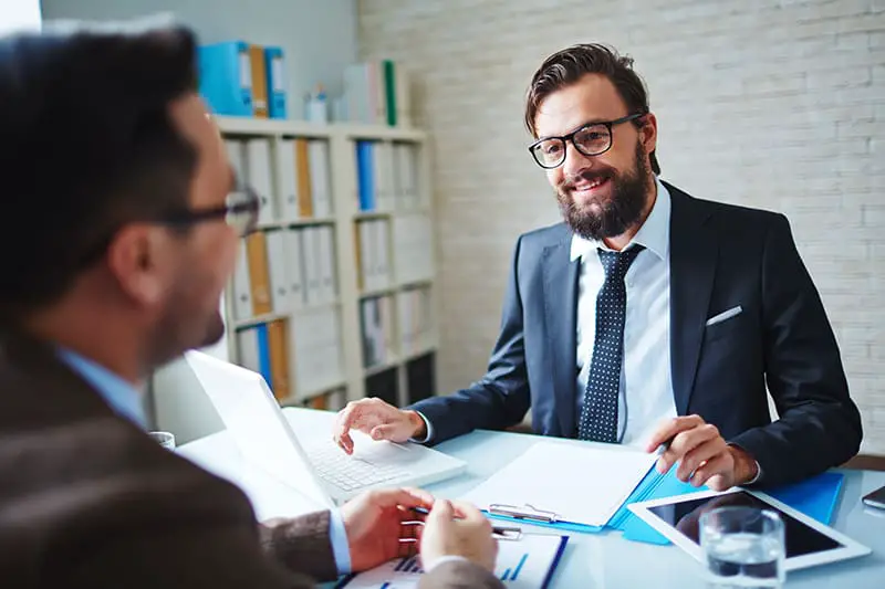 Elegant businessman talking to interviewee