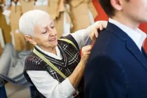 Modern tailor working with customer