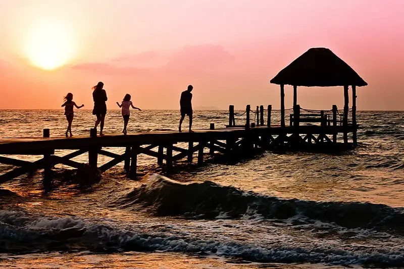 The Importance of Creating Balance in Your Life - family on pier at sunset