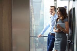 How to Take Your SME to the Next Level - Business partners in the elevator