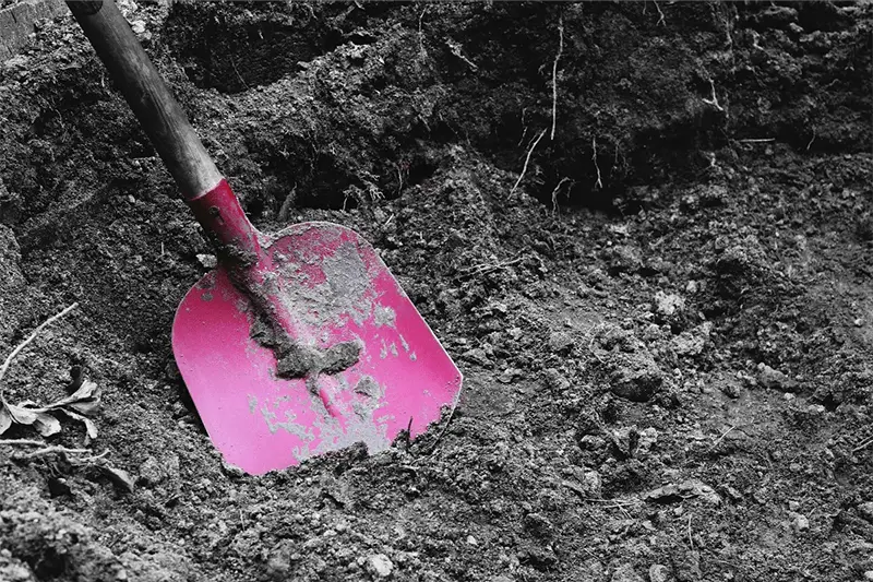 Spade digging a hole in the earth