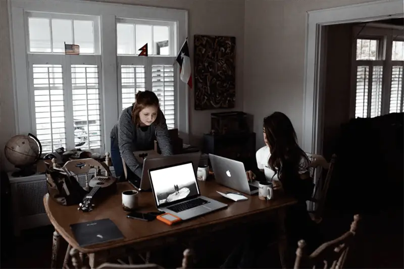 two bloggers at work in their office