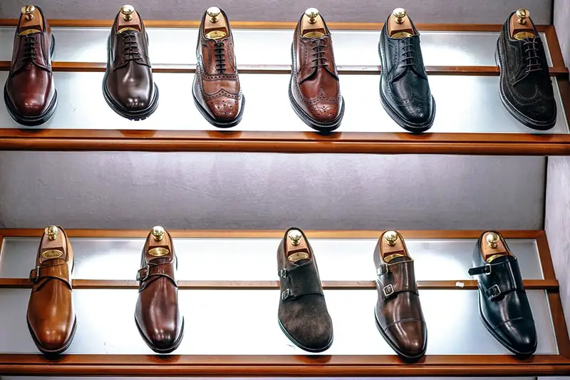 Black and brown classic shoes on shelf