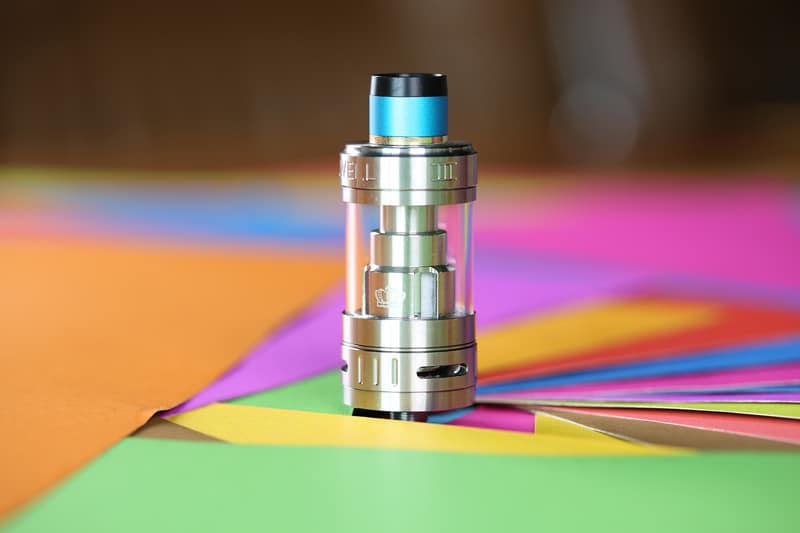 vape electronic cigarette uwell on coloured paper