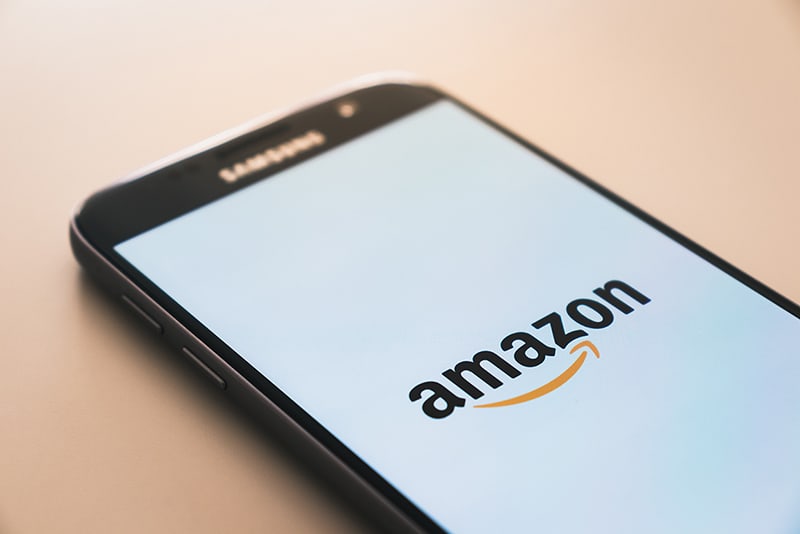 mobile phone showing the Amazon logo