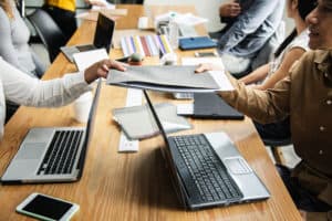 Colleague passing over a file, communication, advice, business 