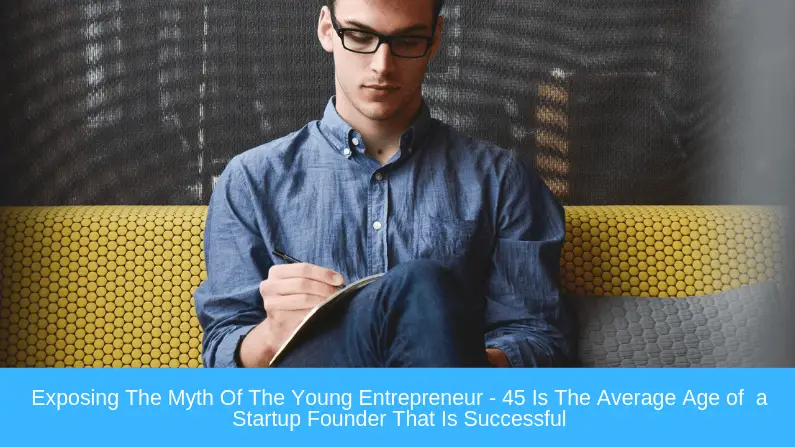 young man sat down writing in note book