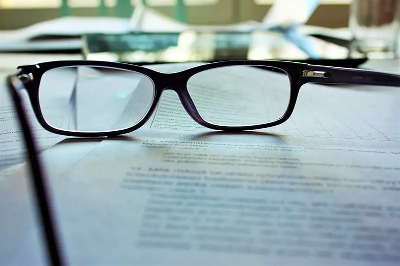 Reading glasses on documents on a table
