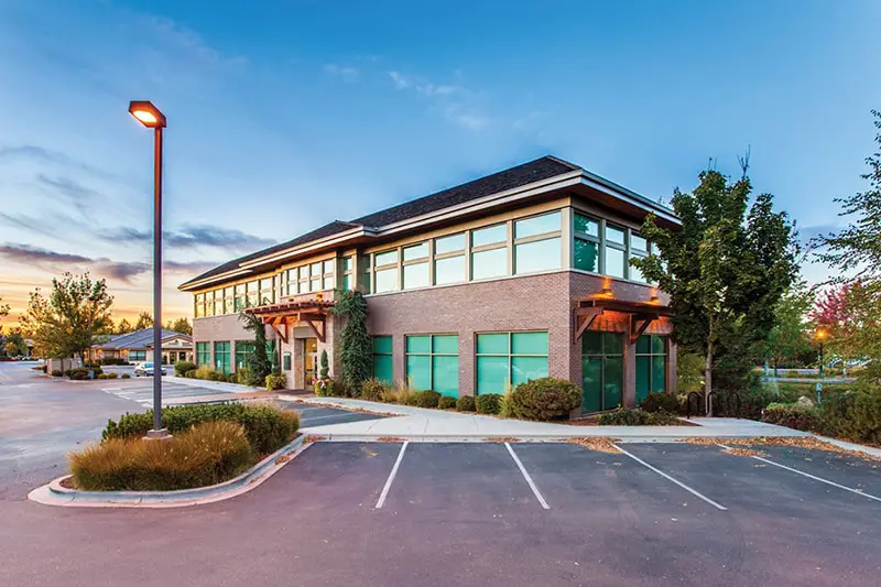 Exterior of two storey building and car park