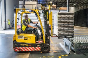 PErson using a forklift in warehouse