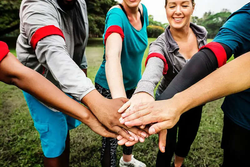 people putting hands together