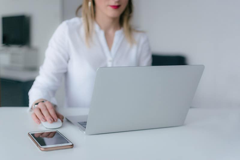 woman using silver laptop doing email address verification