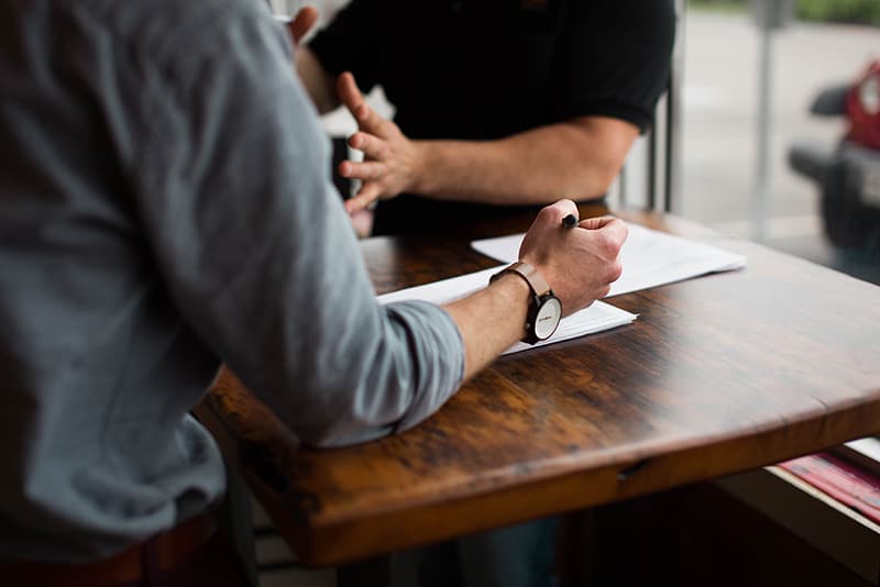 two people having a discussion – mentoring programme