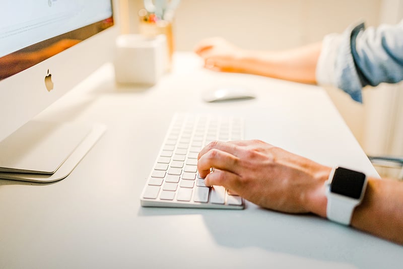 Online Business - person using iMac