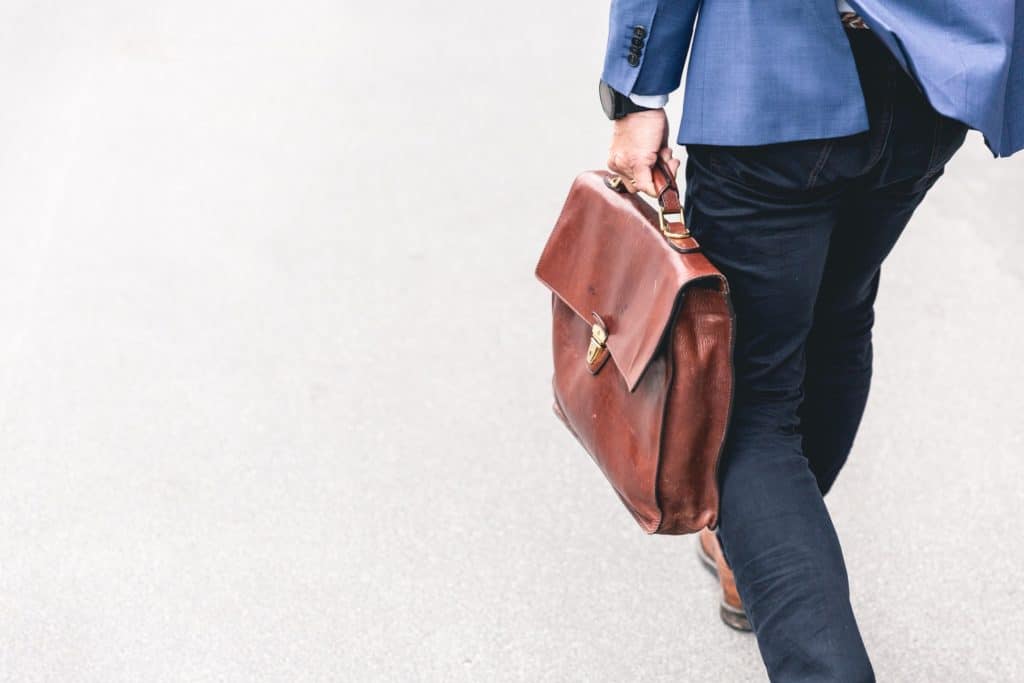Man walking around with business casual outfit something that have become less common which the increased amount of workplaces with casual dresscode.