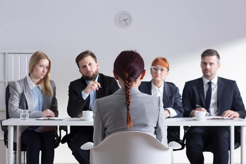 applicant being interview by a panel of interviewers