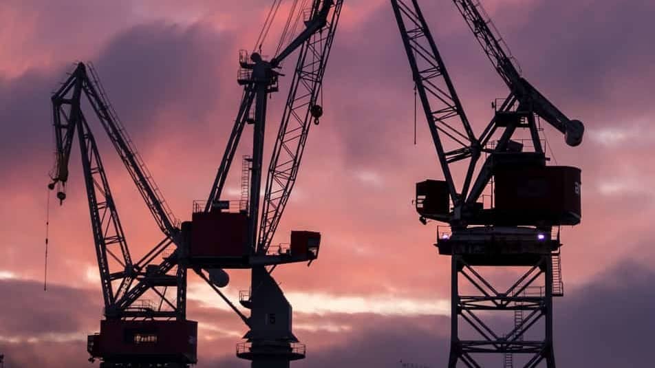 Crane machinery during sunset