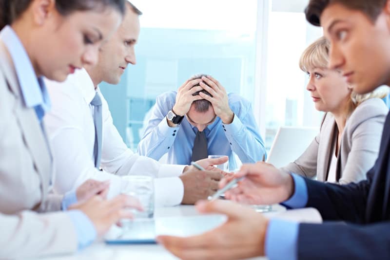 Employees having a meaningless meeting