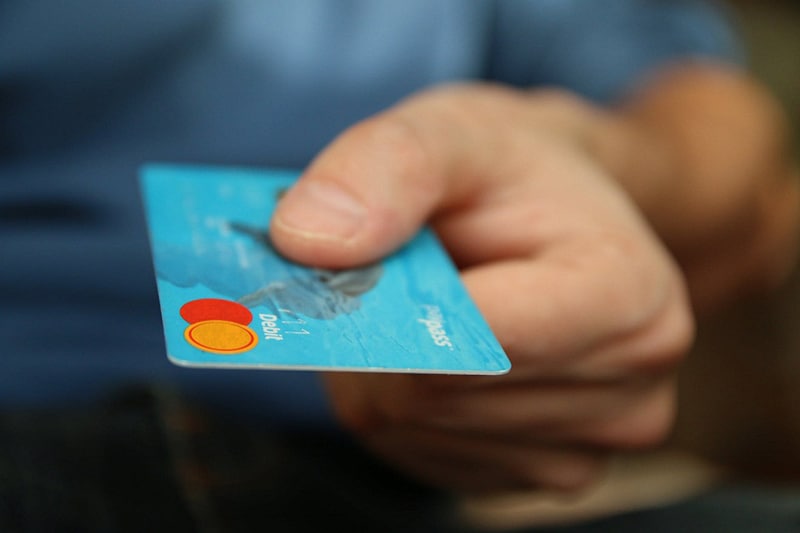 Importance of debt recovery. - person holding a credit card