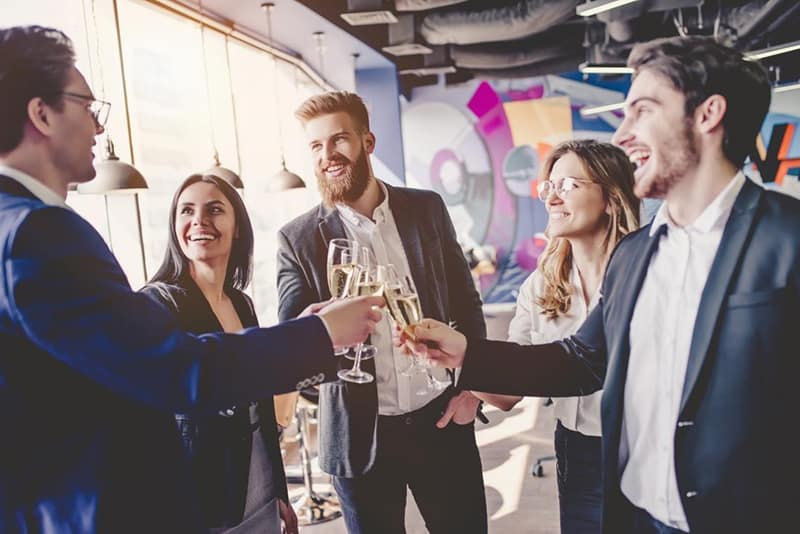 Employees having a drink at event