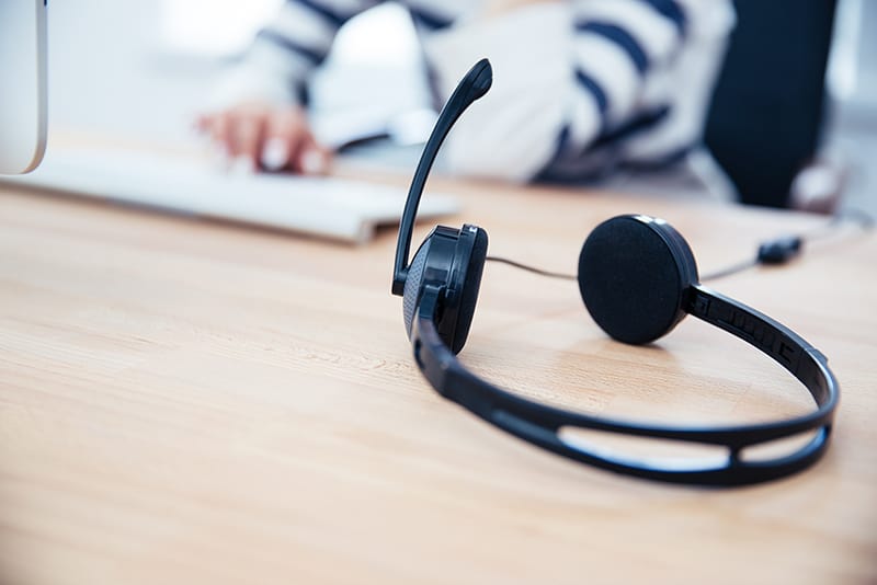 telephone answering service headset on desk