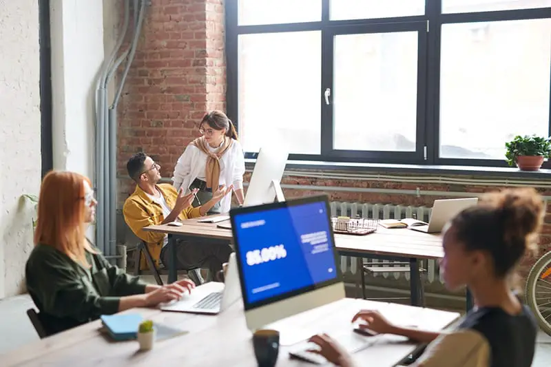 People using computers in office