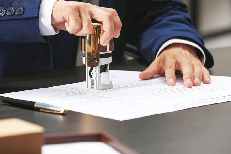 stamping and signing of official document by a notary