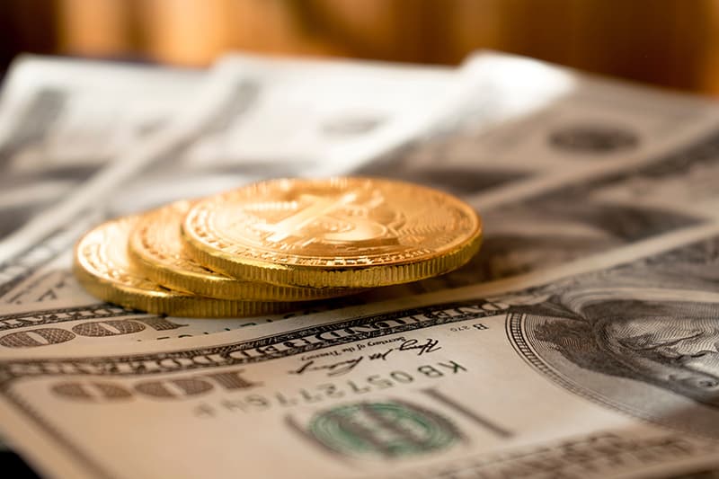 gold coins and dollar bills - business loans