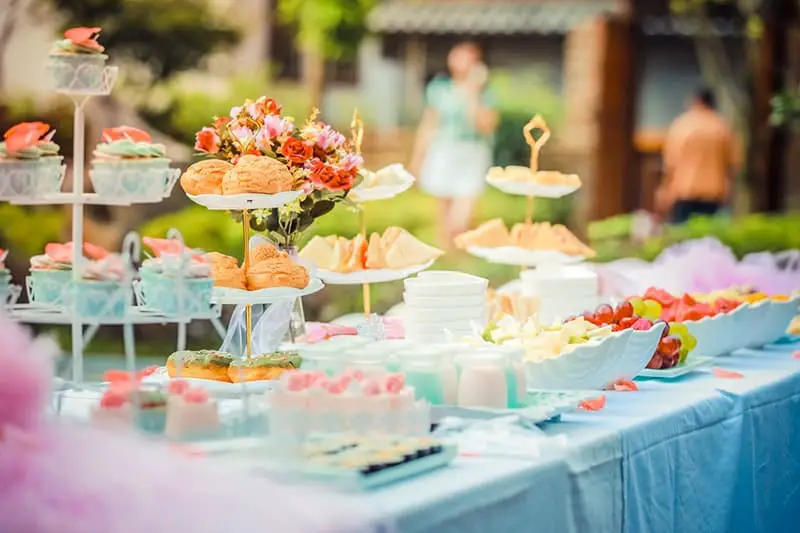 White Steel Cupcake Stand with colourful cupcakes prepared by catering service