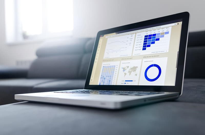 Laptop showing analytics and social media reach