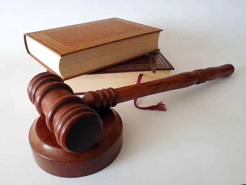 Gavel next to two law books