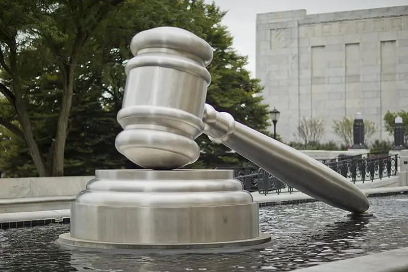 gavel statue pool outside courthouse