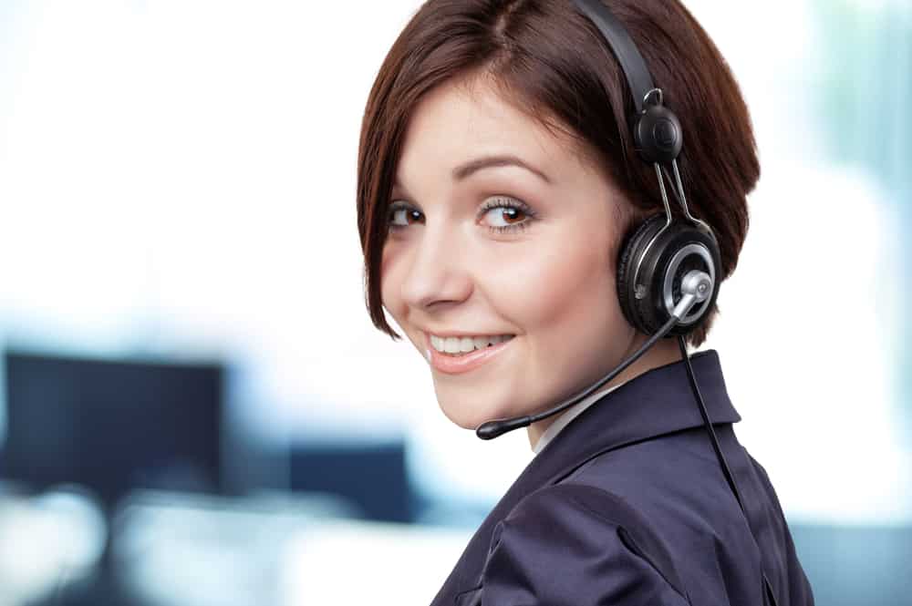 Woman wearing headset in call centre