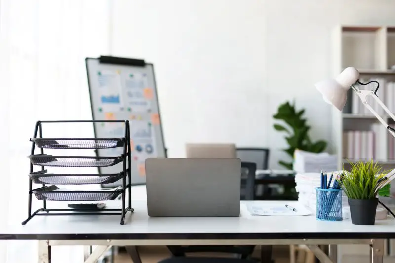 Image of a modern modern office work room with a personal computer laptop in the executive office