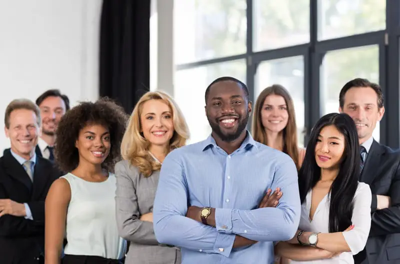 Group of employees standing in office