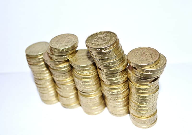 stacks of pound coins sterling - fiscal sponsorship funding
