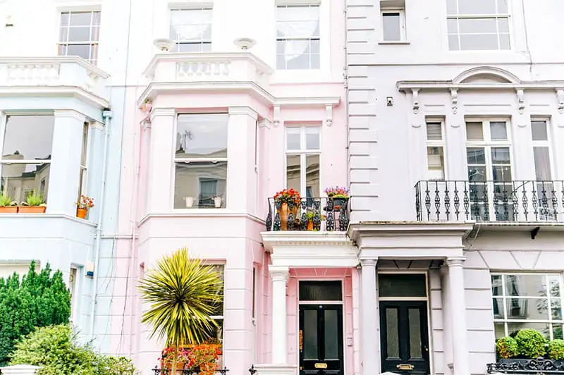 architectural photography of white and pink town house buildings