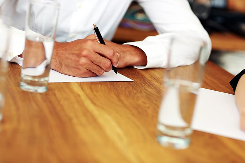 Small business owners preparing to ask questions at an interview